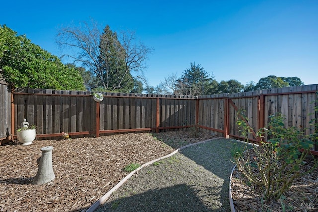 view of yard with a fenced backyard