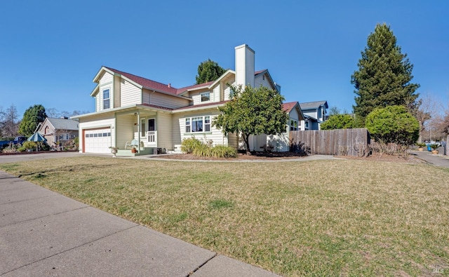 view of front of house with a chimney, concrete driveway, an attached garage, a front yard, and fence