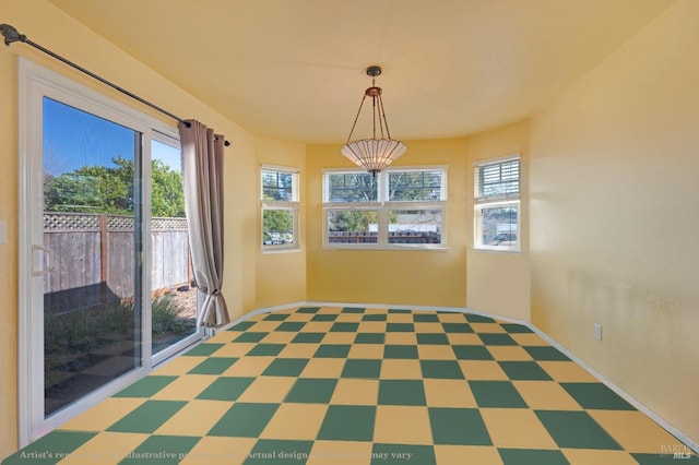 unfurnished dining area with tile patterned floors
