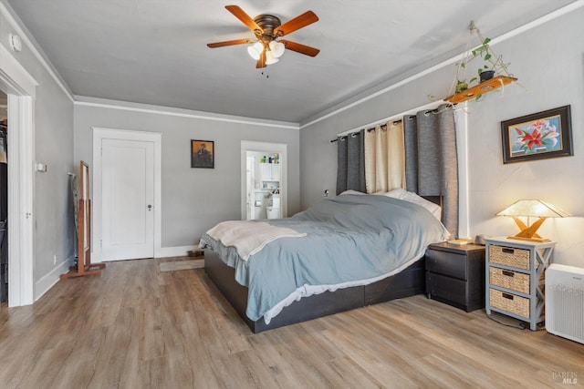 bedroom with ceiling fan, ornamental molding, and light wood-type flooring