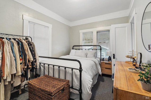 carpeted bedroom with crown molding