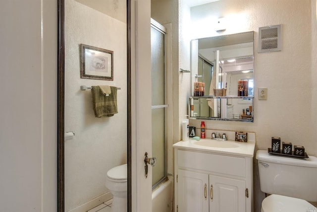 full bathroom with enclosed tub / shower combo, vanity, and toilet