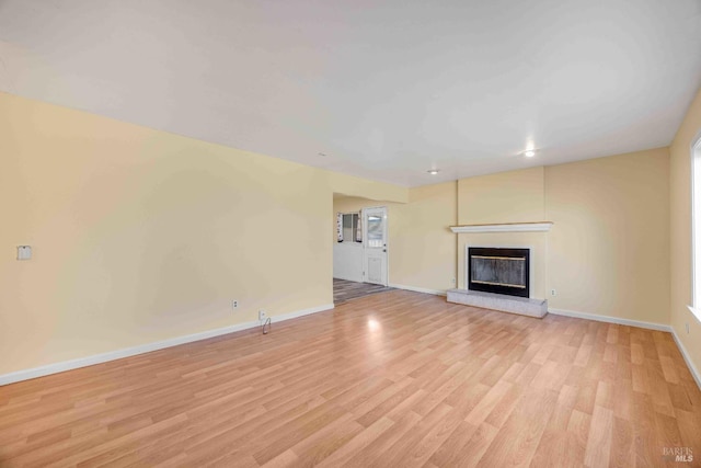 unfurnished living room featuring light hardwood / wood-style floors