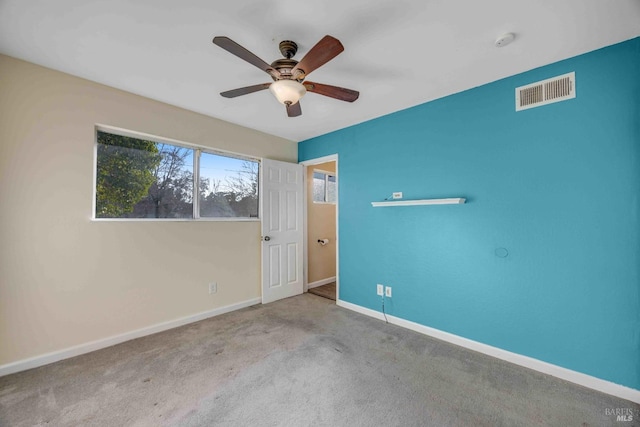 unfurnished bedroom featuring light colored carpet and ceiling fan