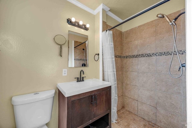 bathroom with vanity, crown molding, toilet, and a shower with shower curtain