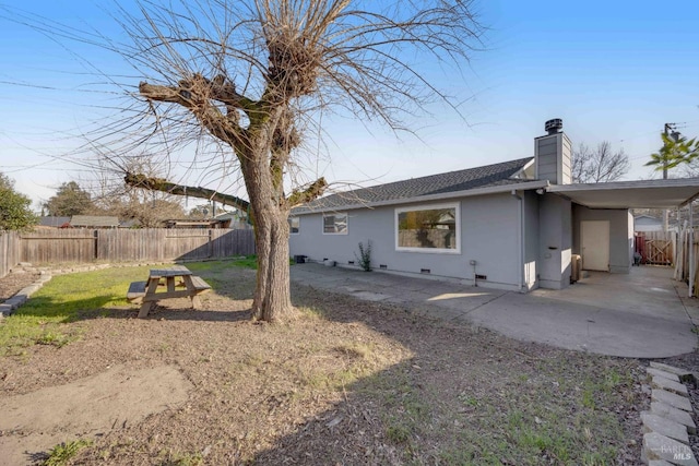 back of house with a patio area