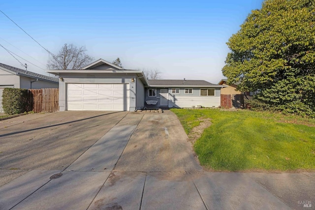 ranch-style home featuring a garage and a front lawn