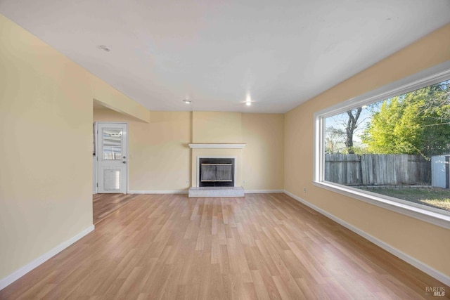 unfurnished living room with light wood-type flooring