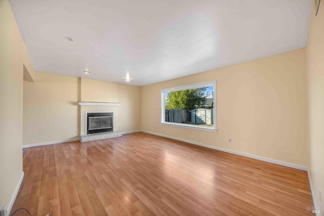 unfurnished living room featuring light wood-type flooring