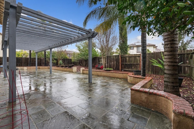 view of patio / terrace with a fenced backyard and a pergola