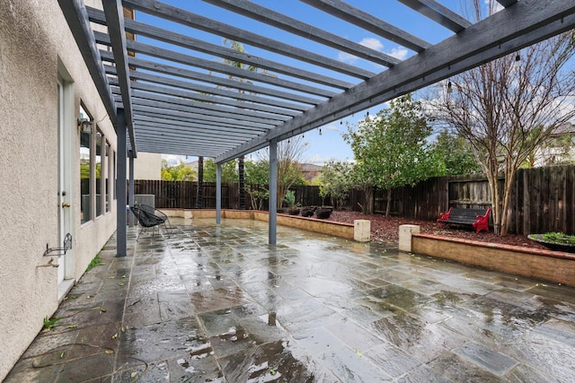 view of patio / terrace featuring a fenced backyard and a pergola