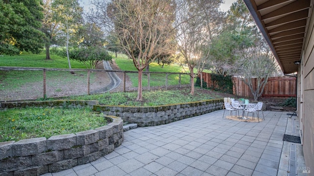 view of patio with a fenced backyard and outdoor dining space