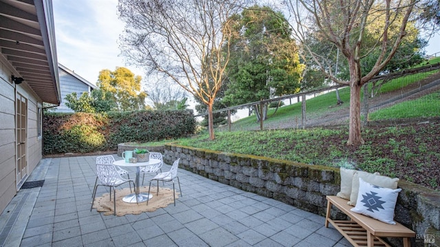 view of patio featuring a fenced backyard and outdoor dining space