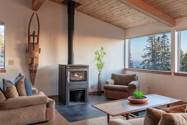 living room with wooden ceiling, vaulted ceiling with beams, and a wood stove