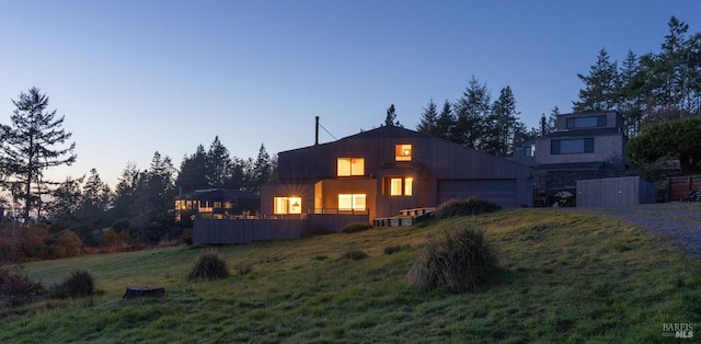 back of house featuring a garage