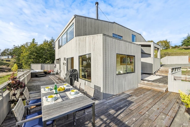 deck with outdoor dining area