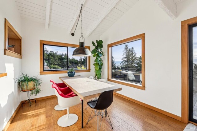 bedroom featuring wood ceiling, high vaulted ceiling, beam ceiling, and light hardwood / wood-style floors