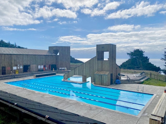 pool featuring a patio and fence