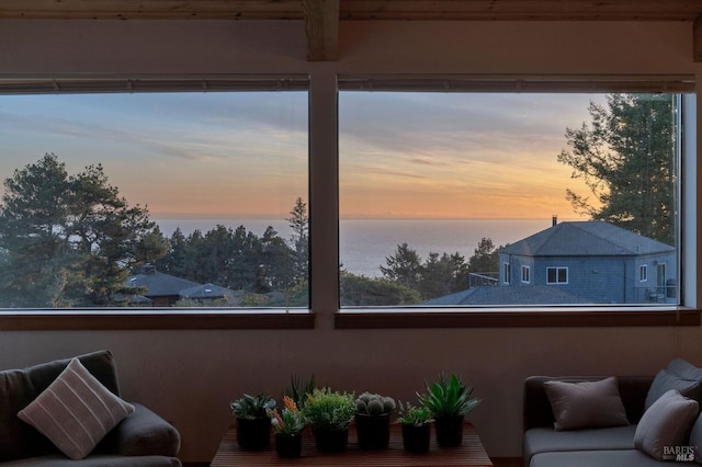 interior space featuring a water view and a wealth of natural light