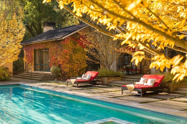 outdoor pool featuring a patio area