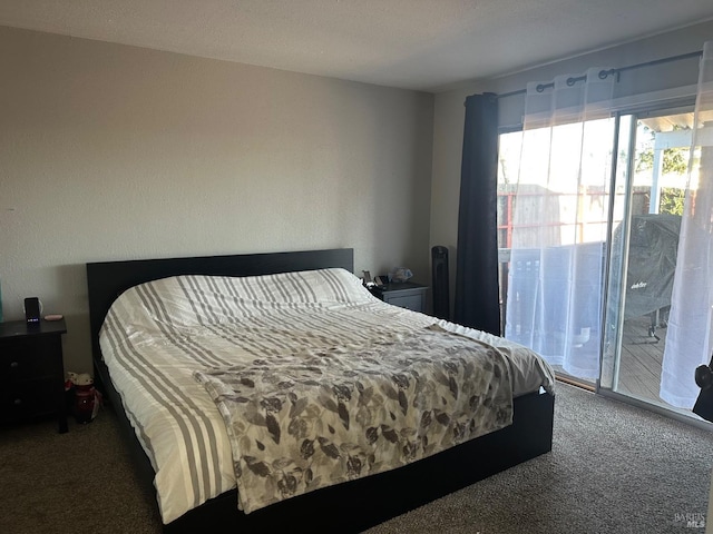 carpeted bedroom featuring access to exterior