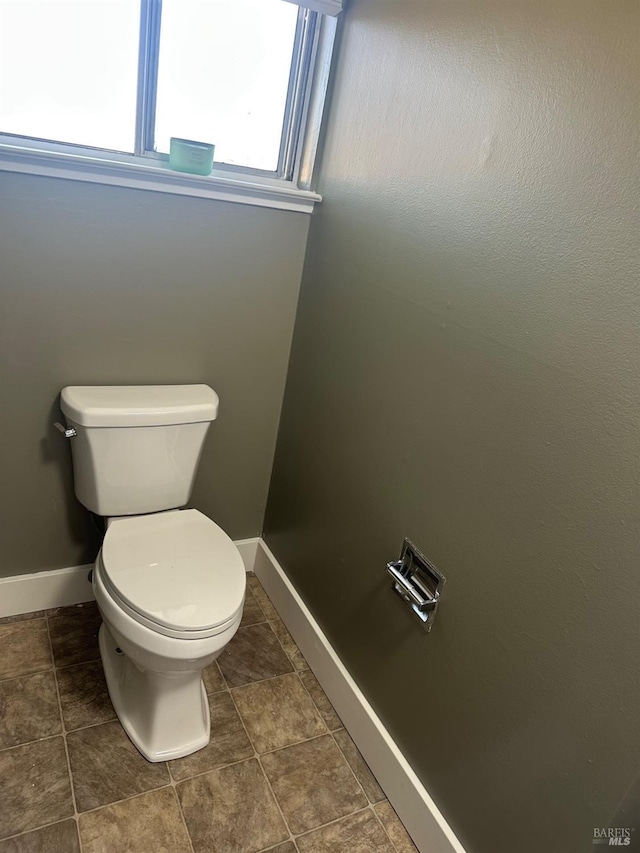 bathroom with tile patterned floors and toilet