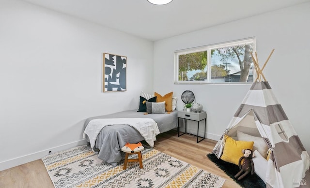 bedroom with light hardwood / wood-style flooring