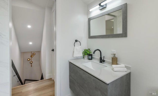 bathroom with vanity and wood-type flooring