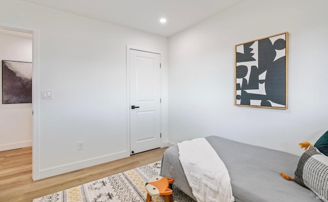 bedroom with hardwood / wood-style flooring