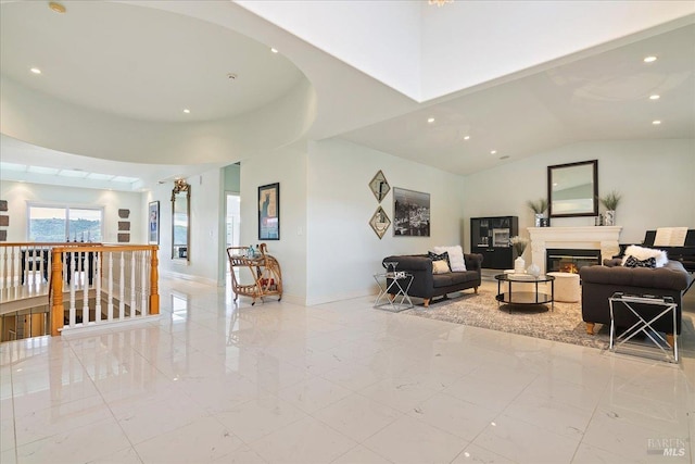 living room featuring high vaulted ceiling