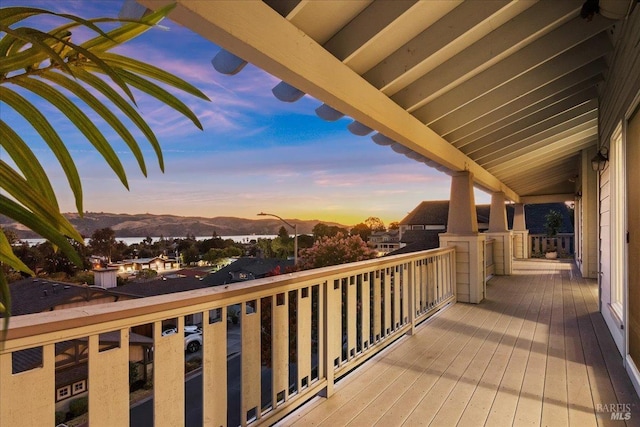 deck at dusk with a mountain view