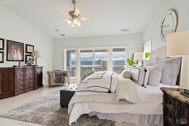 bedroom featuring lofted ceiling and light tile patterned floors