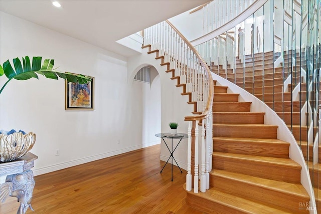 staircase featuring hardwood / wood-style flooring