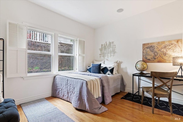 bedroom with hardwood / wood-style floors