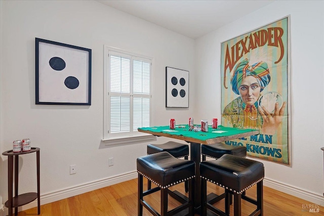 dining space featuring hardwood / wood-style flooring