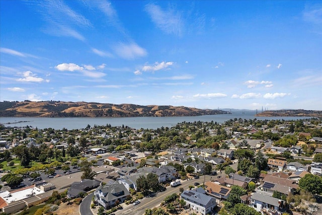 bird's eye view with a water and mountain view