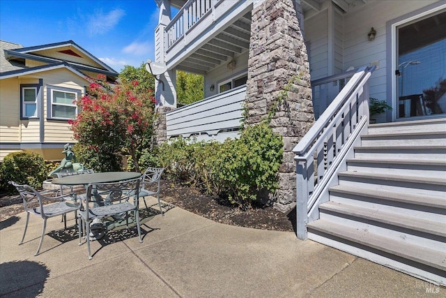 view of patio / terrace with a balcony