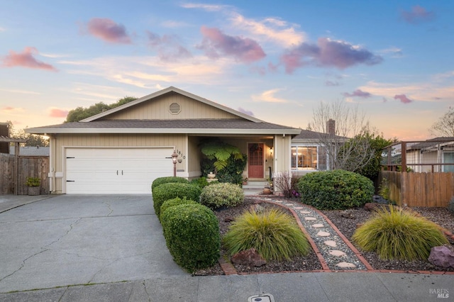 ranch-style home featuring a garage