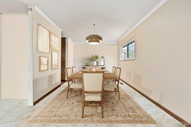 carpeted dining area with ornamental molding