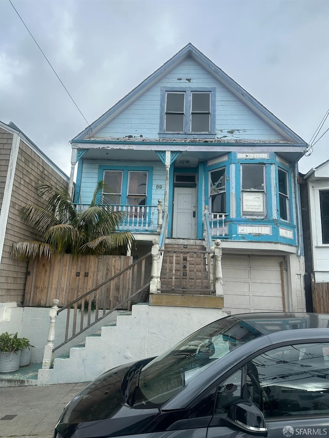 view of front of home with a garage and covered porch