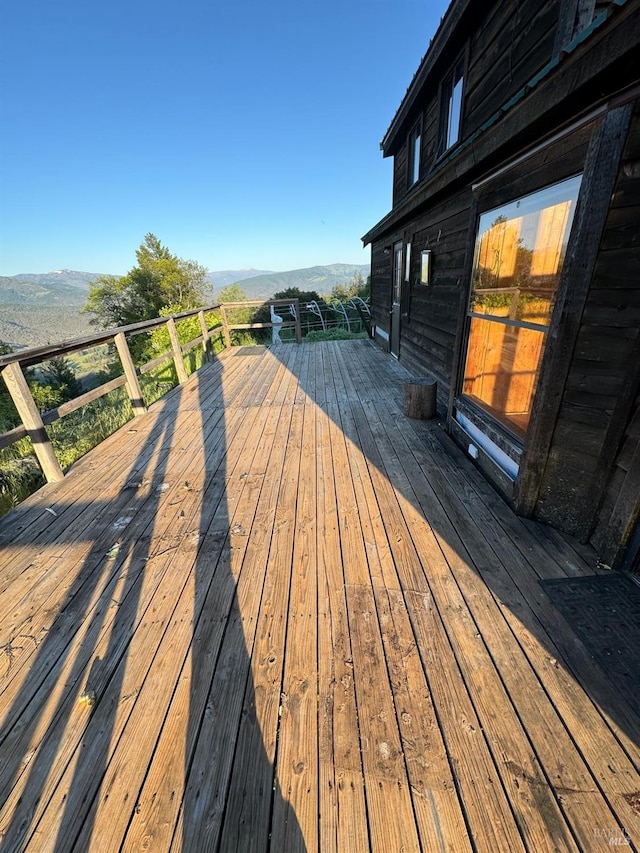 wooden terrace with a mountain view