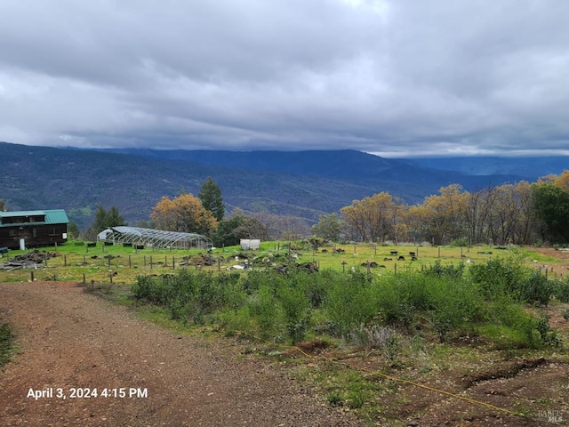 property view of mountains featuring a rural view