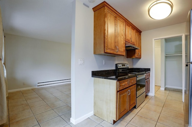 kitchen featuring baseboard heating, stainless steel range with electric stovetop, dark stone counters, and light tile patterned floors