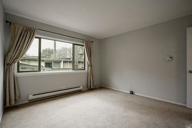 empty room with light carpet and a baseboard heating unit