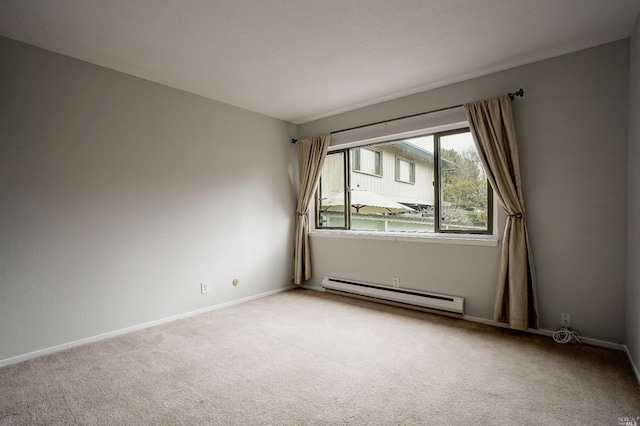 carpeted empty room with a baseboard radiator