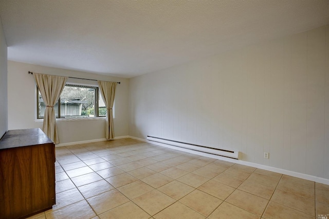 tiled empty room with baseboard heating