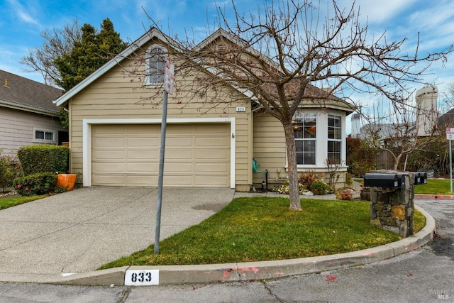 view of front facade with a garage and a front yard