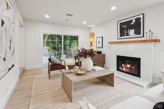 interior space featuring a fireplace and light hardwood / wood-style floors