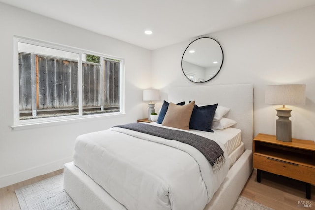 bedroom with light hardwood / wood-style flooring