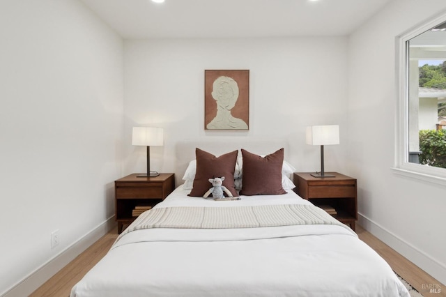 bedroom with light hardwood / wood-style floors